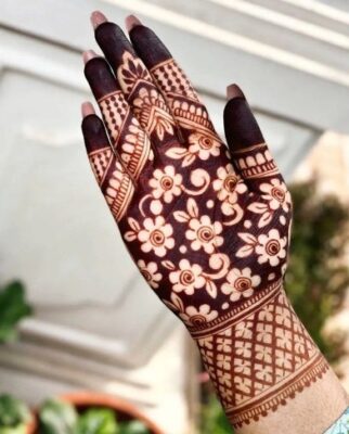 A Royal Front Hand Mehndi Design enhances the palm elegantly