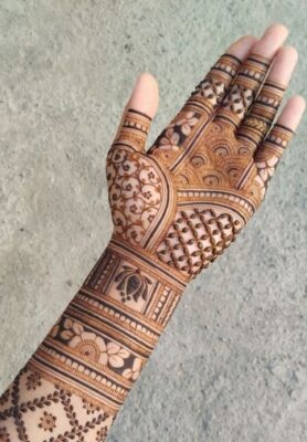 A Royal Front Hand Mehndi Design pairs well with bridal jewelry