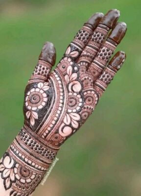 A Royal Front Hand Mehndi Design suits both modern and ethnic outfits