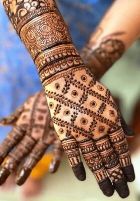A bold Full Hand Mehndi Design stands out beautifully