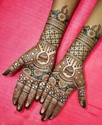 A mandala Full Hand Mehndi Design looks neat and mesmerizing