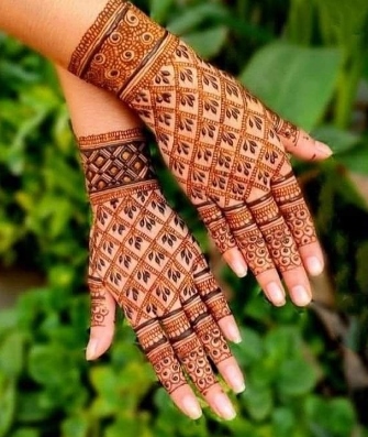 A modern Full Hand Mehndi Design creates a trendy look