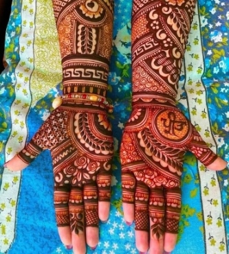 A trendy Full Hand Mehndi Design suits modern brides