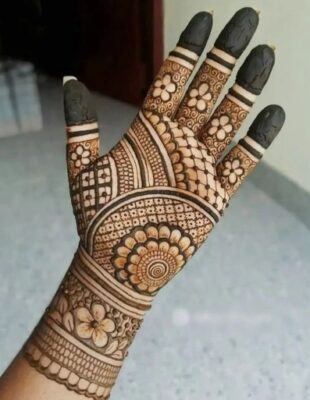 Artists enjoy the creativity of a Royal Front Hand Mehndi Design