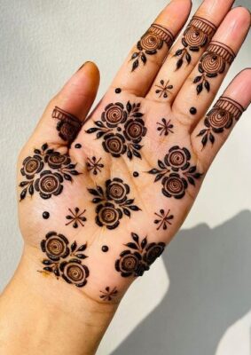 Beautiful Front Hand Mehndi Design completes the look