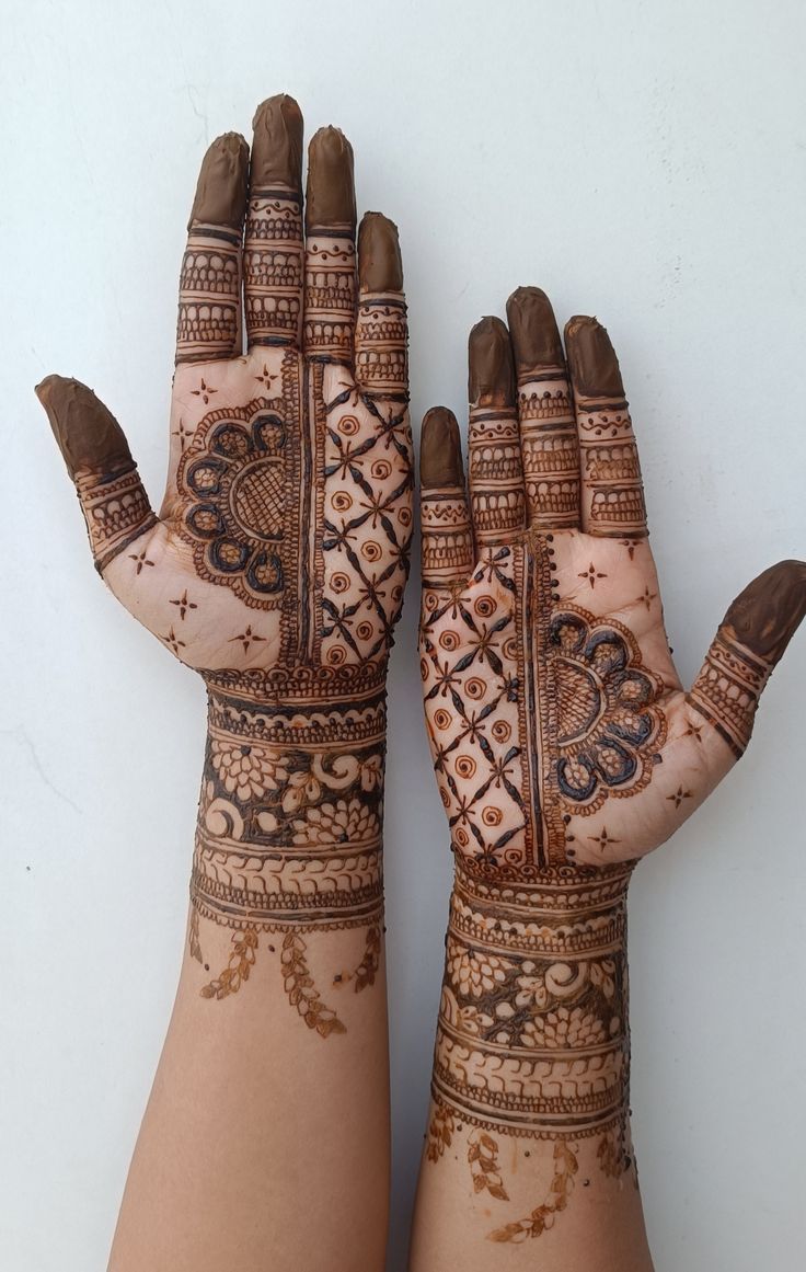 A detailed royal front hand mehndi design enhances hand beauty