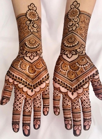 Bold strokes highlight a royal front hand mehndi design perfectly