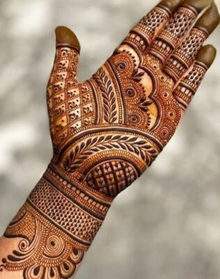 Bridal Mehndi Design includes floral and paisley designs
