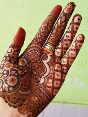 Royal Front Hand Mehndi Design is admired for its rich detailing