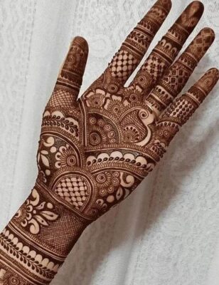 A dark stain makes the Full Hand Mehndi Design look even more beautiful