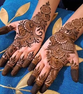 Full Hand Mehndi Design patterns can include paisleys, flowers, and mandalas