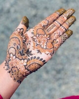 Simple Front Hand Mehndi Design uses floral and leaf motifs