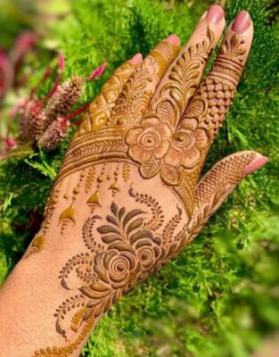 Stylish Back Hand Mehndi Design adds charm to traditional outfits