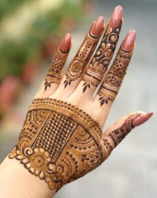 Stylish Back Hand Mehndi Design adds charm to traditional outfits