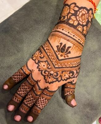 Traditional Back Hand Mehndi Design adds a classic touch to any festive look